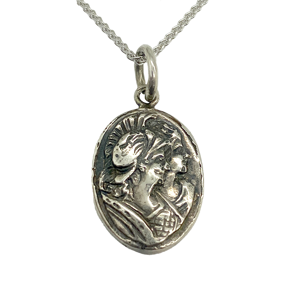 Oval silver pendant with two female figures