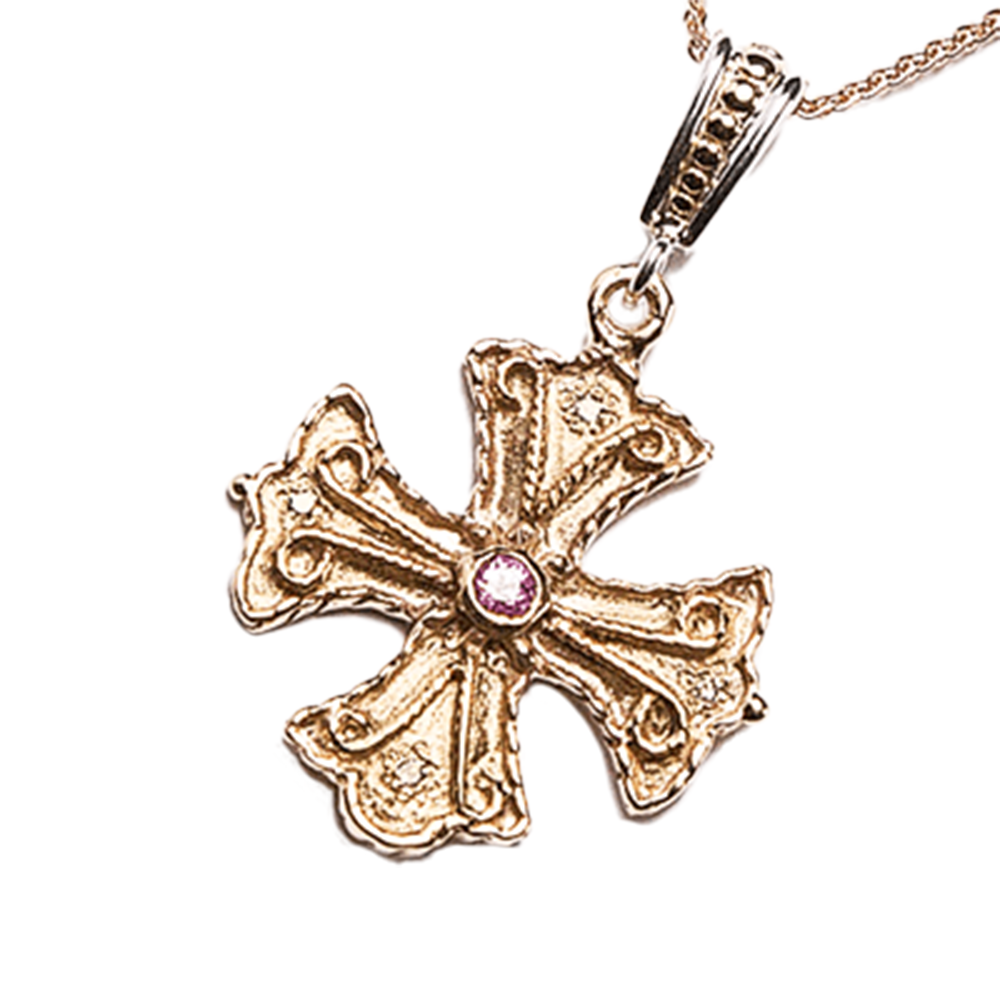 Silver cross pendant with a center gemstone on a white background