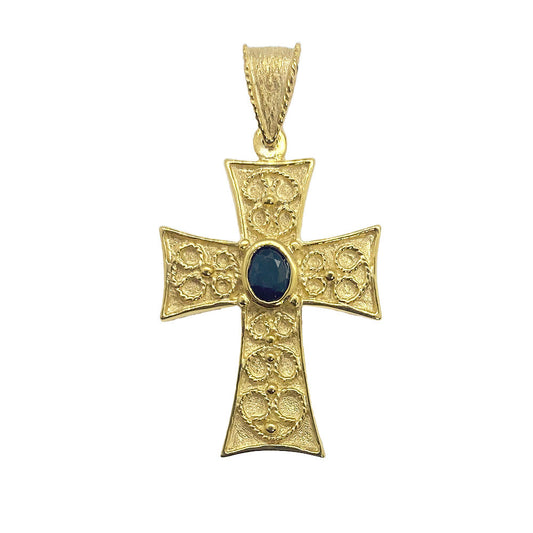 Gold cross pendant with a center gemstone on a white background