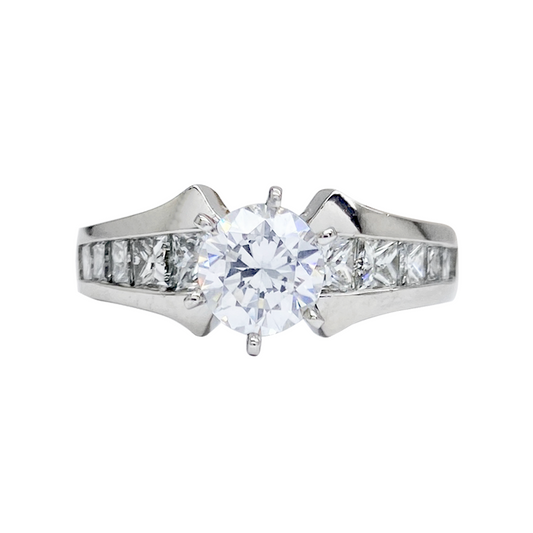 Silver princess-cut diamond engagement ring with a channel setting and a split shank design.