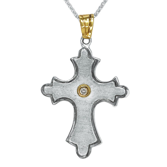 Silver cross pendant on a white background