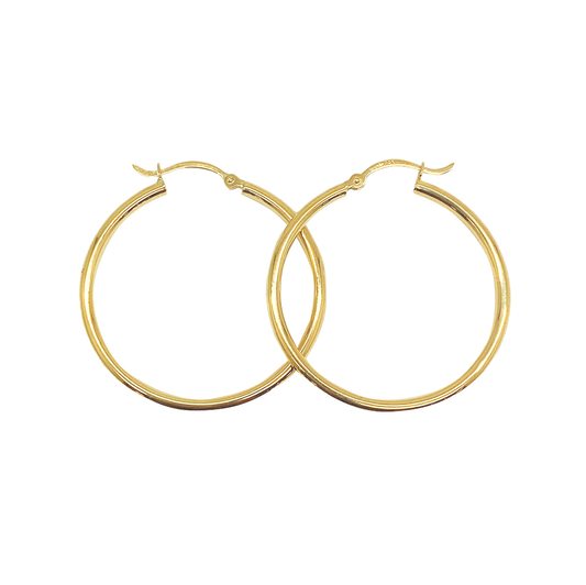 Gold hoop earrings on a white background