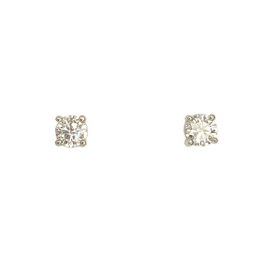 Pair of round diamond stud earrings with four-prong settings.