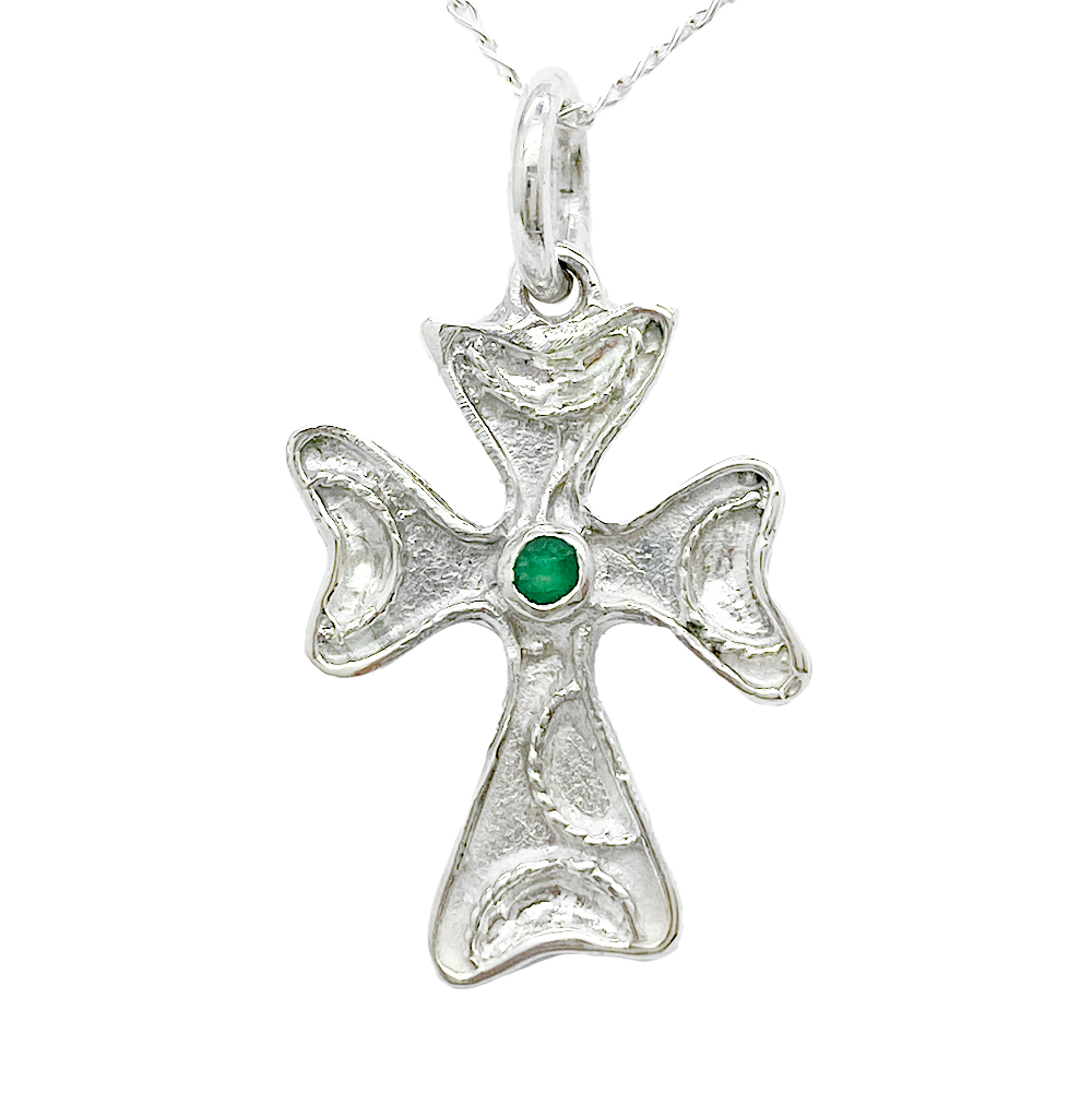 Silver cross pendant with gemstone.