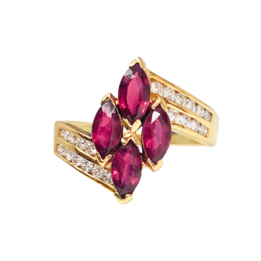 Gold ring featuring a cluster of four marquise-cut rubies, accented by diamonds along the band.