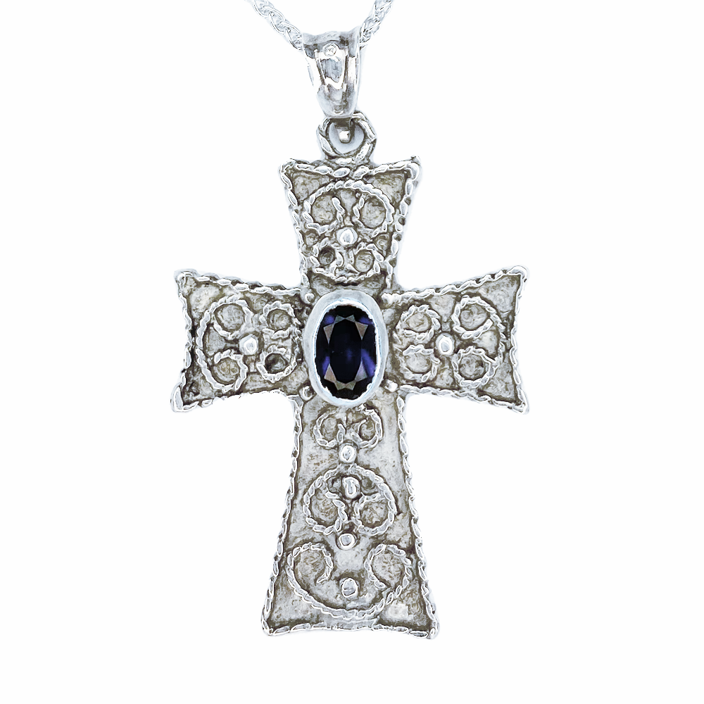 Silver cross pendant with gemstone.