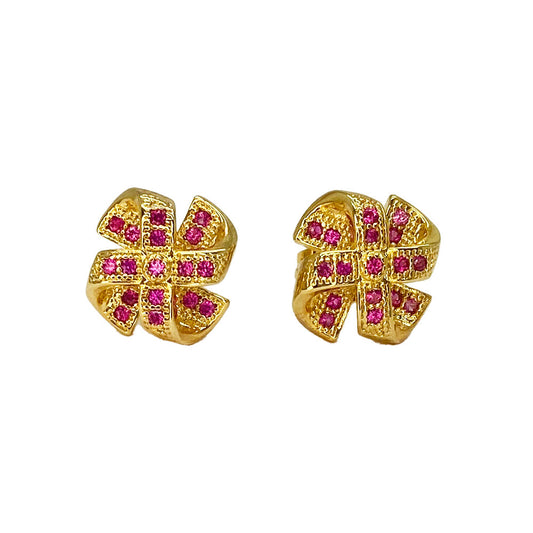 Gold bow-shaped stud earrings with pink stones.