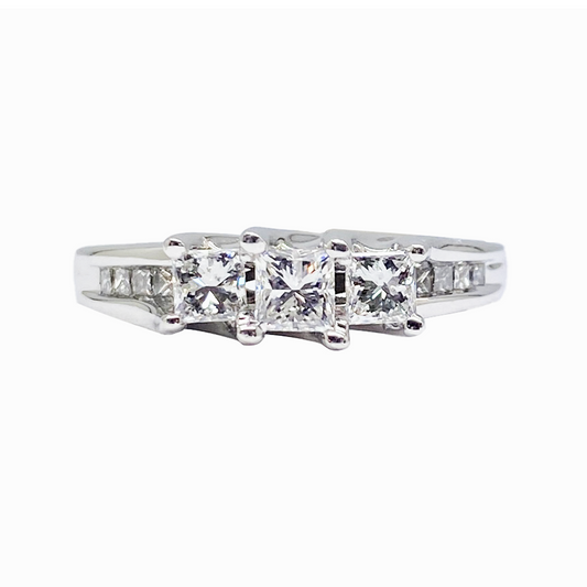 Silver three stone diamond Ring with princess-cut center stone and channel-set side stones