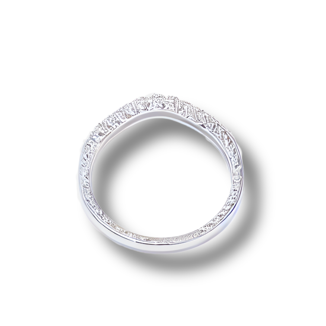 Silver wedding band with a curved design and diamond accents, on a white background