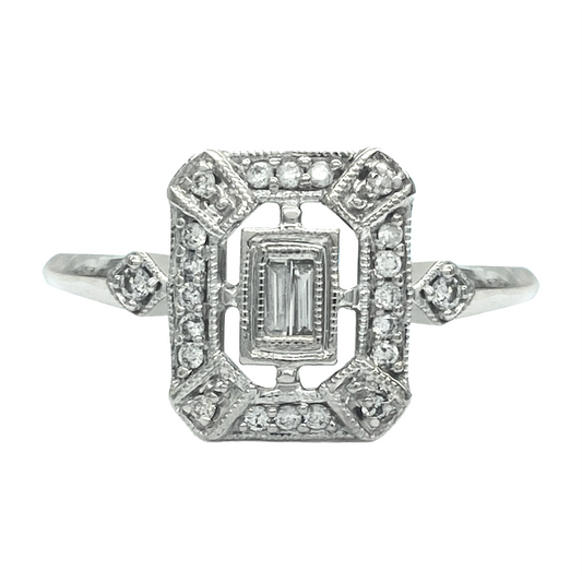 Silver vintage platinum ring featuring a rectangular baguette-cut diamond in a geometric setting with diamond accents.