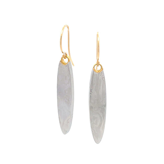 Pair of gold oval shaped earrings with a damascus steel pattern, on a white background.