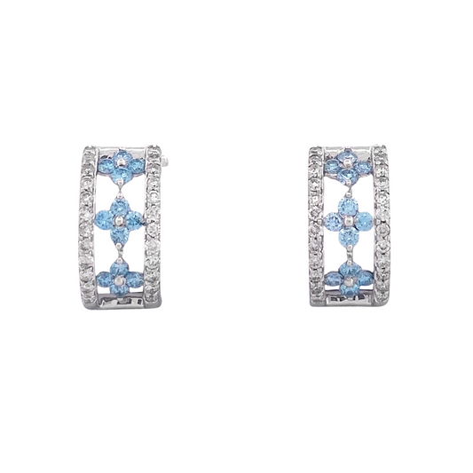 Pair of silver huggie earrings featuring aquamarine and natural diamond accents in a floral design.