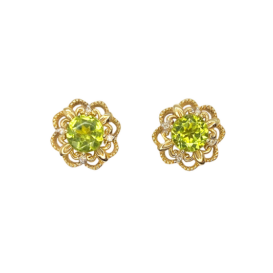 Pair of gold stud earrings featuring round peridot gemstones surrounded by intricate floral filigree detailing with diamond accents.