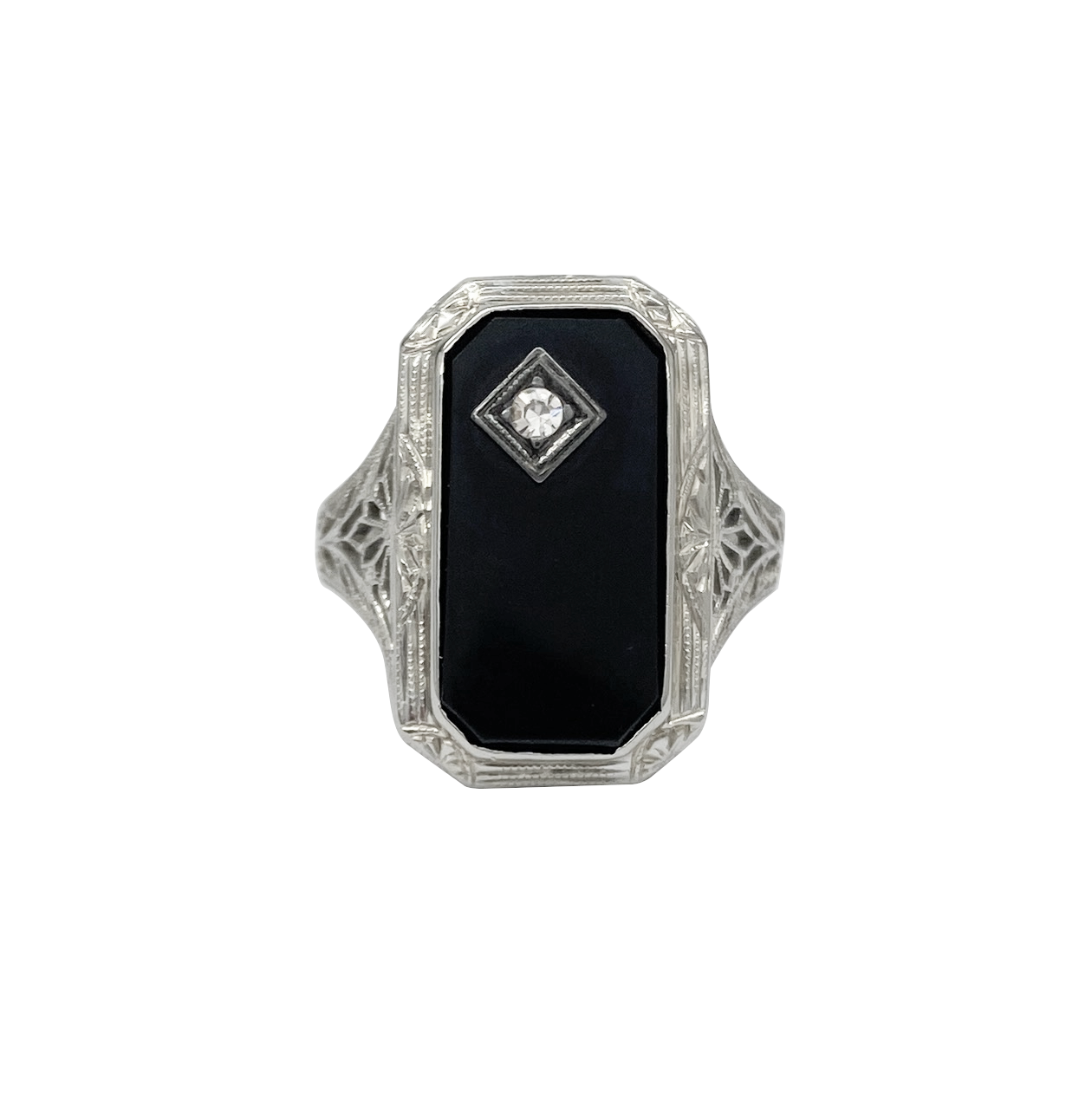 Art deco silver ring with black onyx stone and a small diamond accent in the center on a white background.