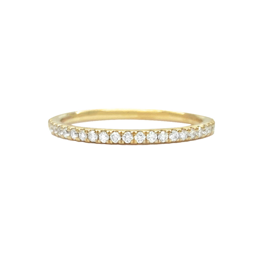 Gold eternity band with round-cut diamonds, on a white background.