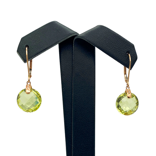 Pair of gold drop earrings with round, faceted peridot gemstones.