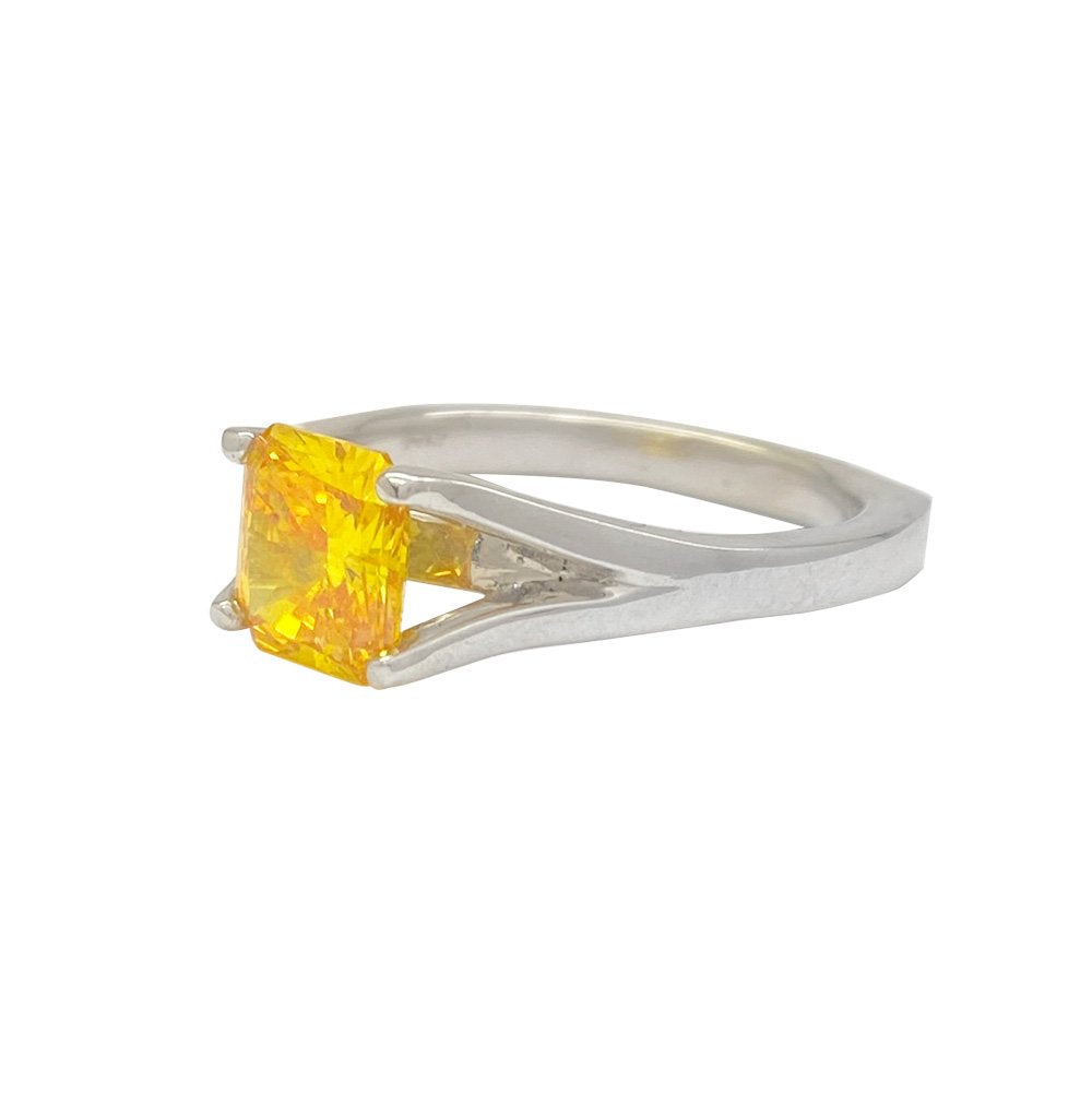 Silver ring yellow gemstone in split-shank design.