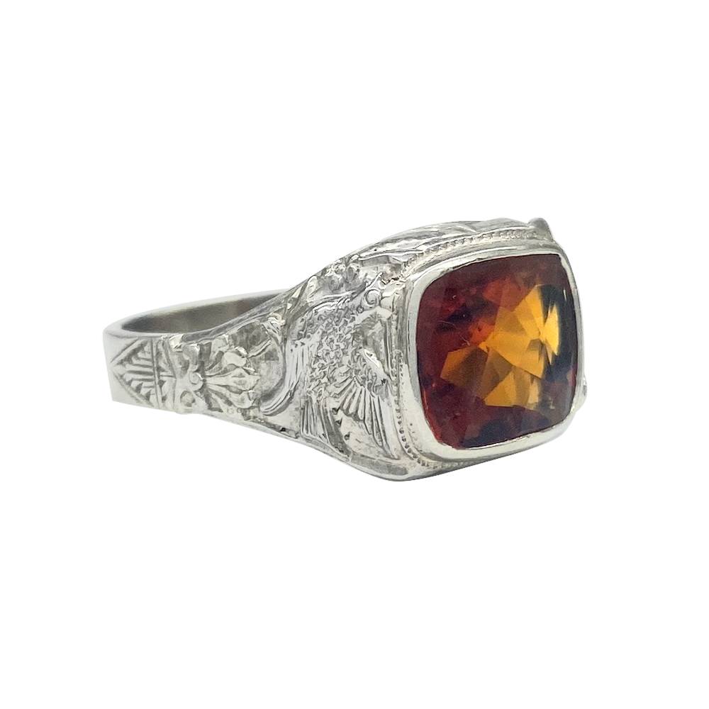 Silver ring featuring a large cushion-cut citrine set in a platinum bezel.