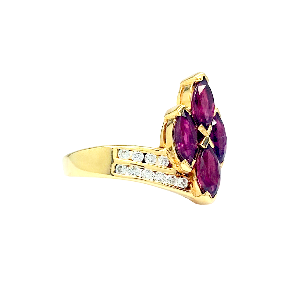 old ring featuring a cluster of five marquise-cut rubies, accented with smaller diamonds along the band.