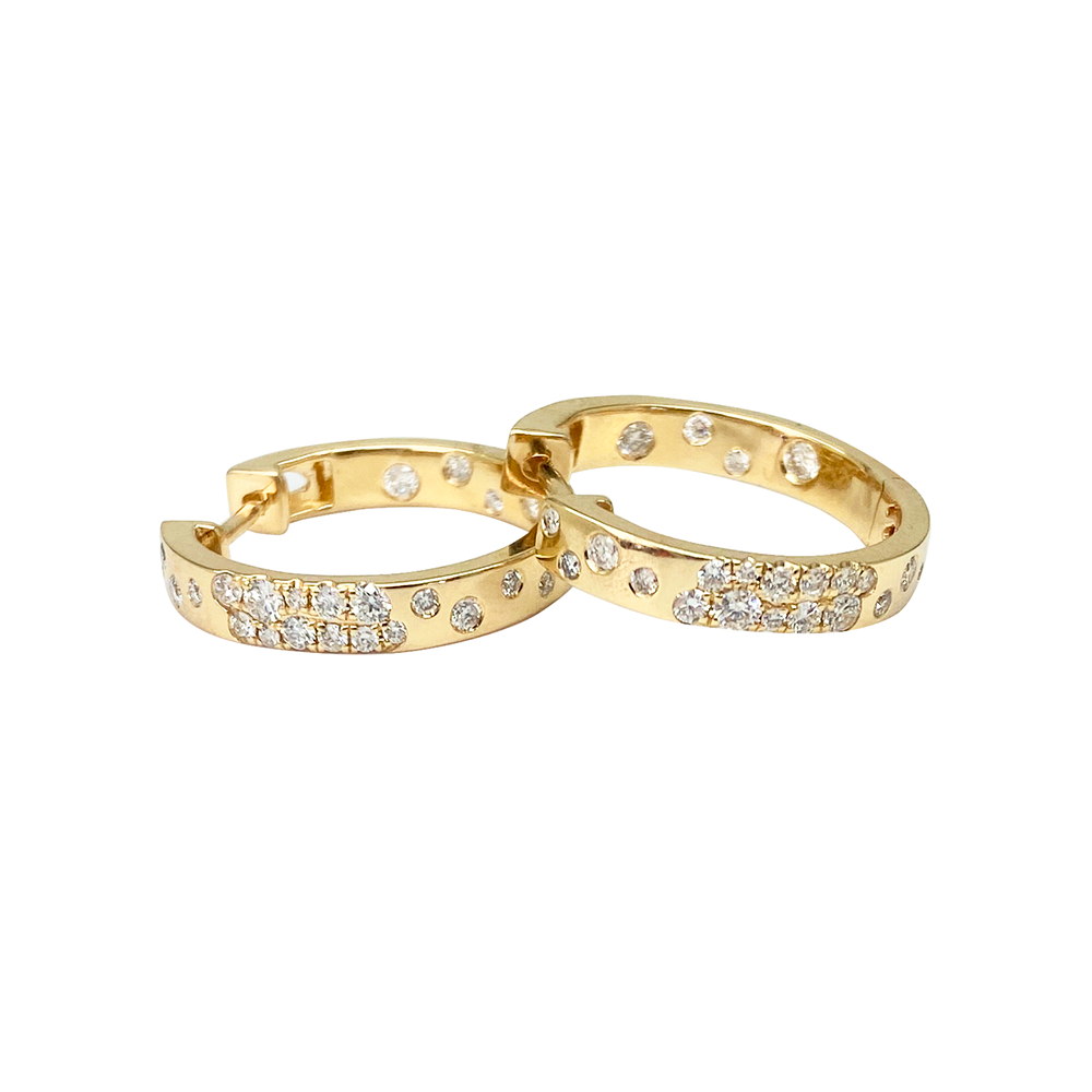 Yellow gold hoop earrings with diamond accents, on a white background