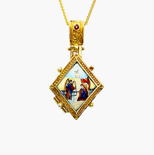 Gold locket necklace with a square pendant depicting a religious scene on a white background