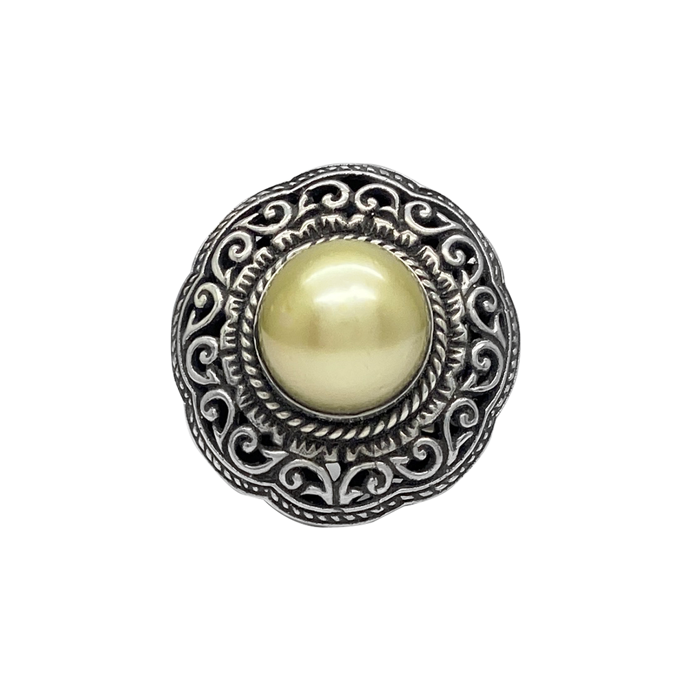 Silver ring with a large, round pearl set in an intricate filigree design, on a white background.