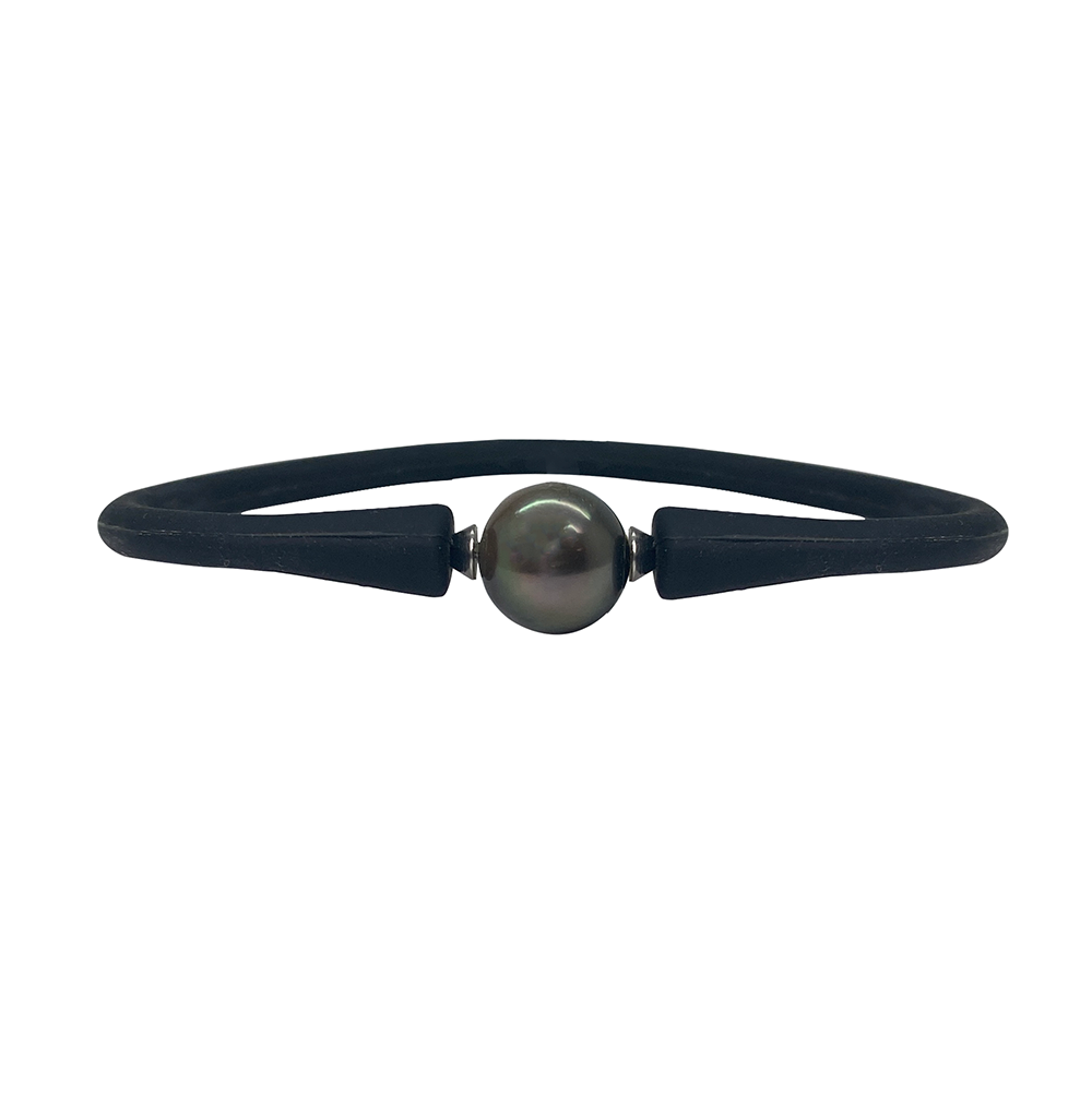 Black silicone bracelet with a large, black pearl in the center