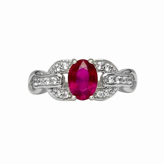 Oval ruby ring with diamond accents in a white gold setting