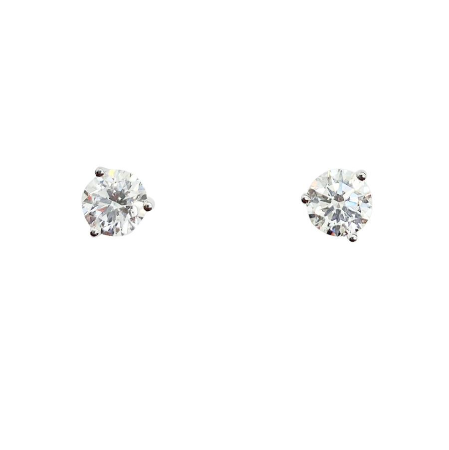 White gold stud earrings with round-cut diamonds, on a white background