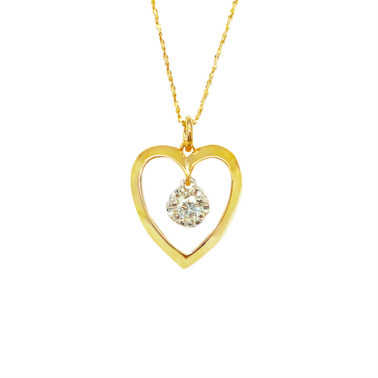 Gold heart-shaped pendant necklace with a diamond in the center, on a white background