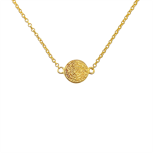 Gold necklace with a circular pendant on a white background