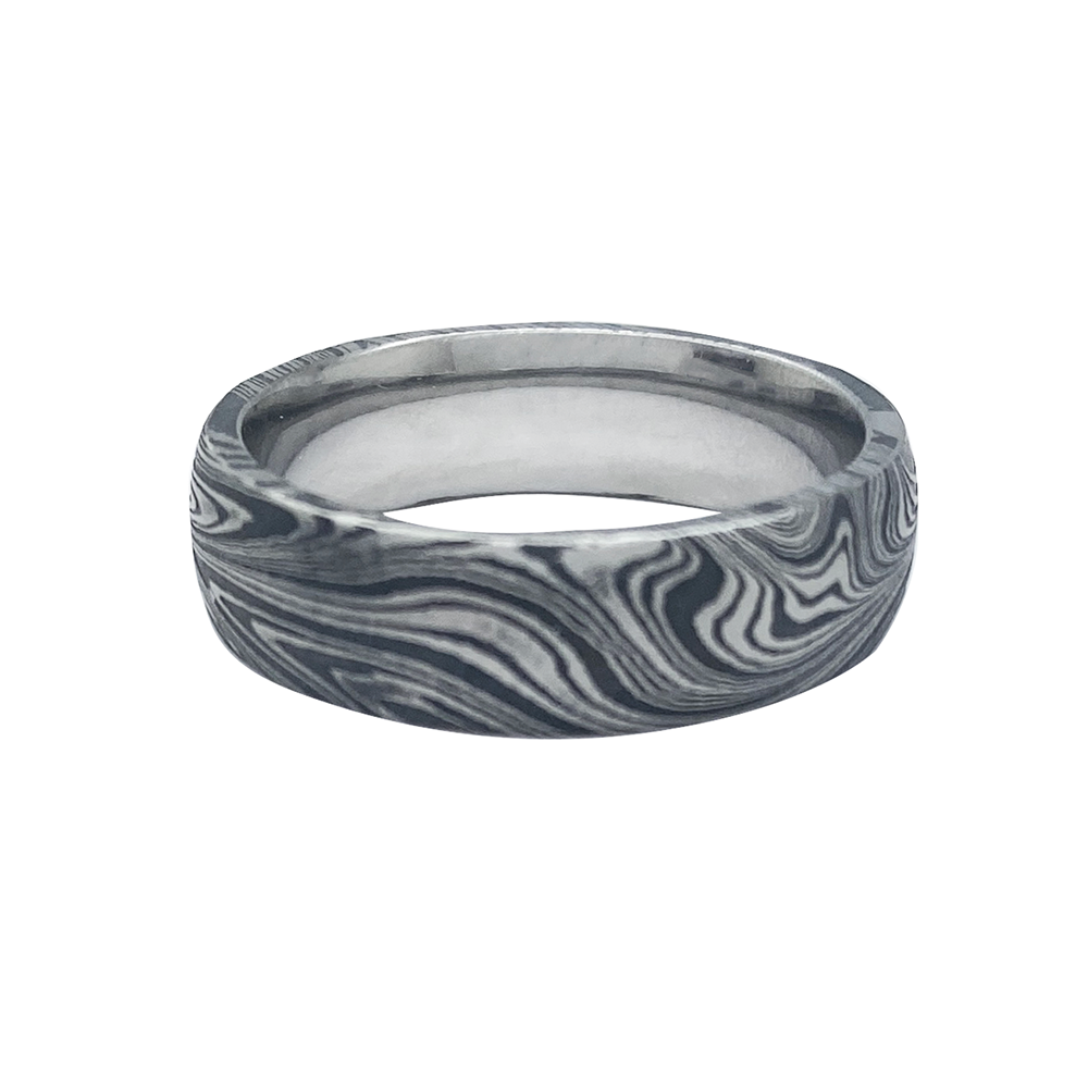 Silver ring with a Damascus steel pattern, on a white background.