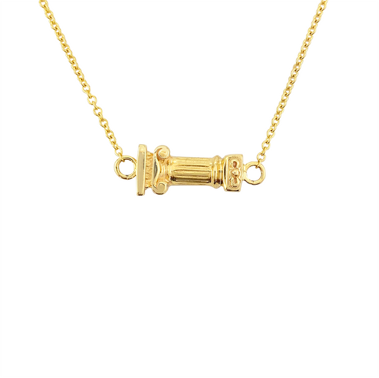 Gold necklace with a column-shaped pendant on a white background.