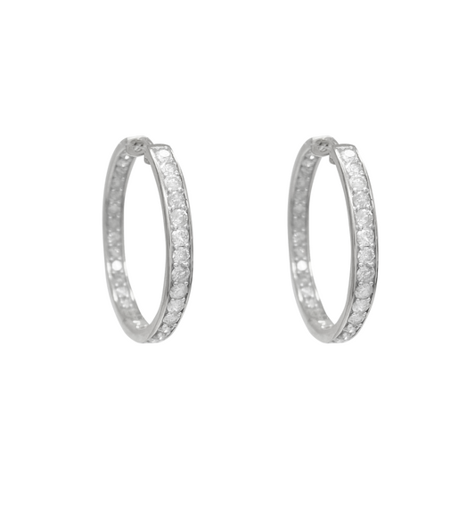 White gold diamond hoop earrings on a white background.