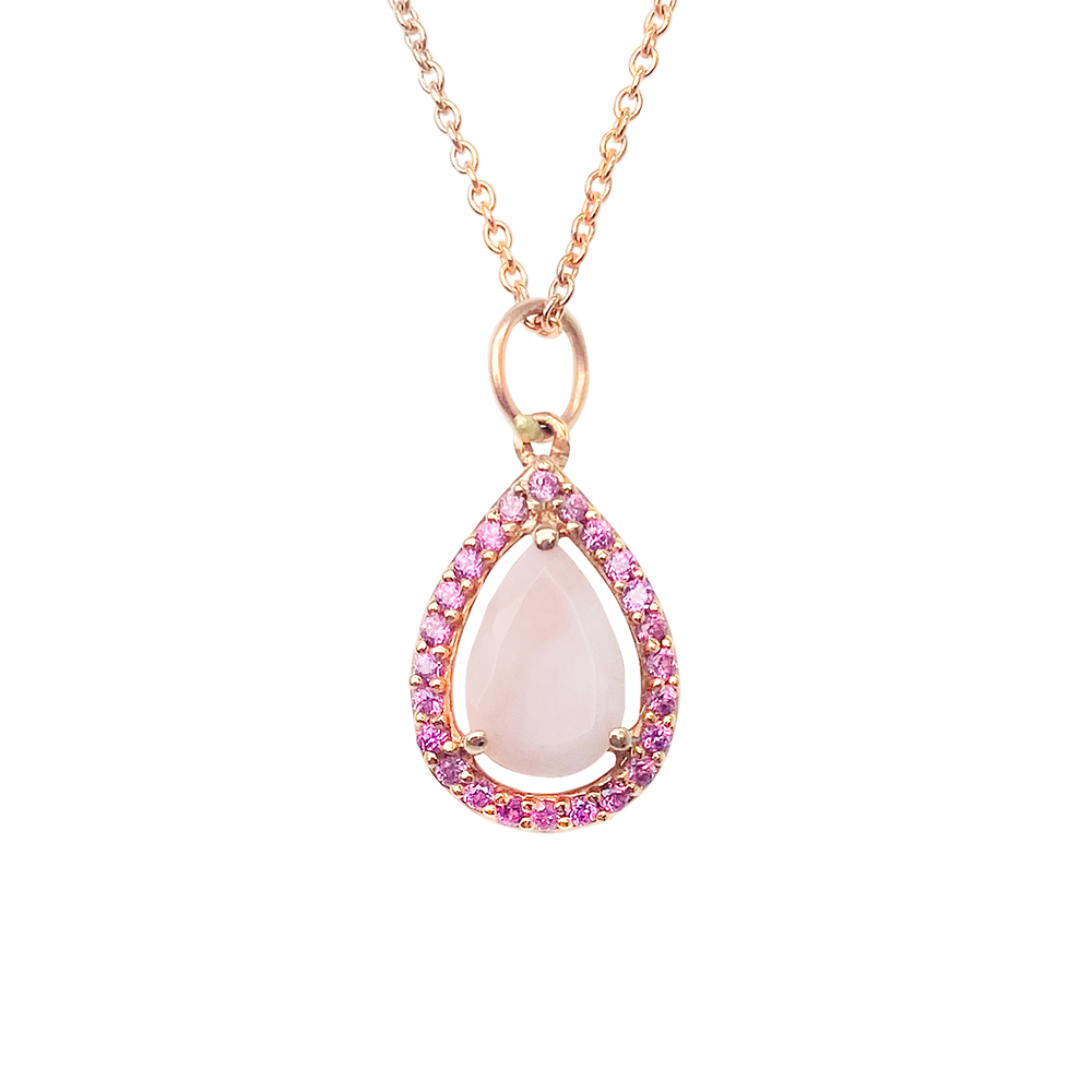 Rose gold necklace with an opal and diamond pear shaped pendant on a white background.