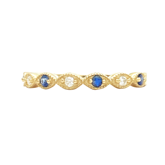 Gold band with alternating oval sapphires and diamonds, set in marquise.