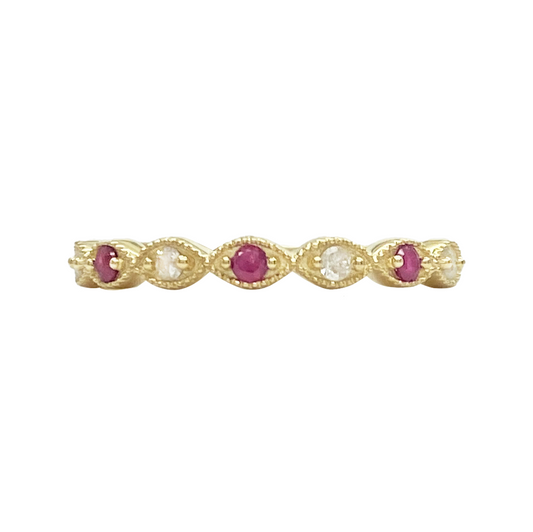 Gold band with alternating oval rubies and diamonds, set in marquise.