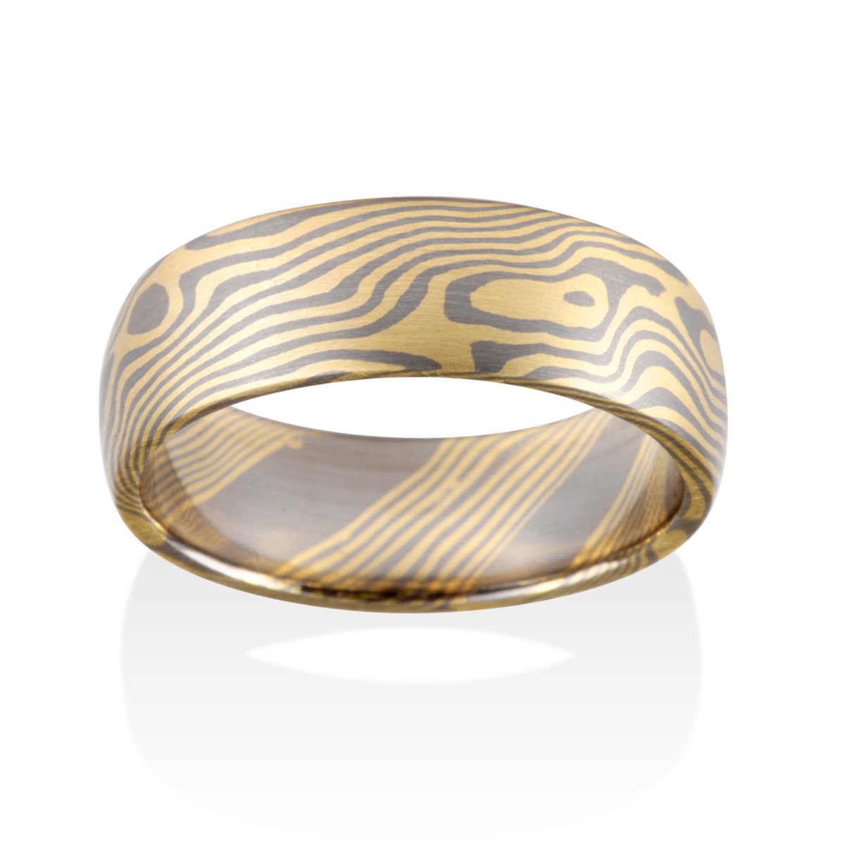 Damascus steel band ring on a white background