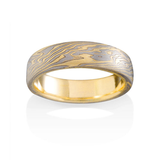 Damascus steel band ring on a white background