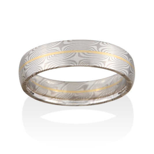 Damascus steel band ring on a white background