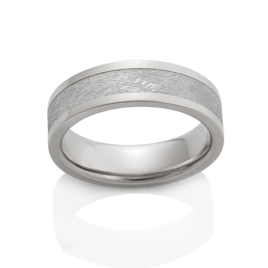 Silver ring with a meteorite inlay on a white background.