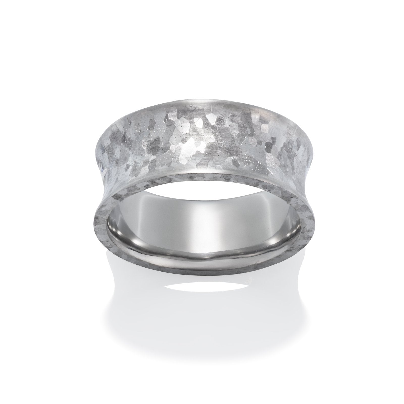 Silver ring with meteorite-like surface on a white background.