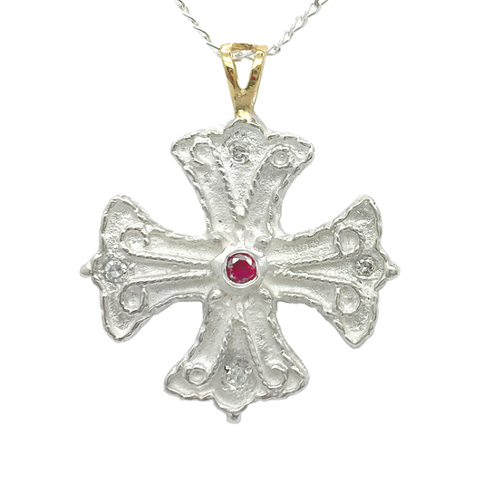 Byzantine-style sterling silver cross with a central ruby and diamond accents.