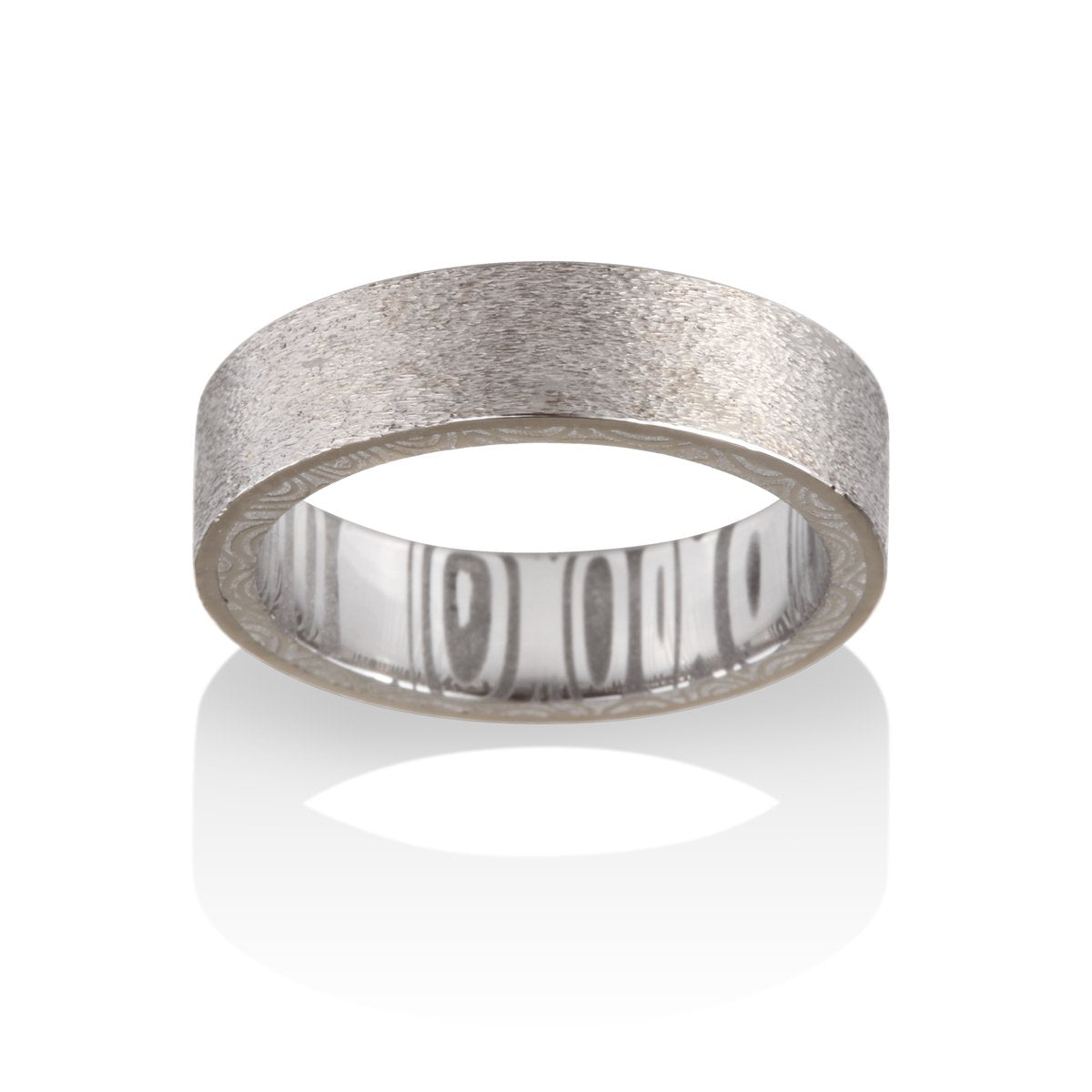 Silver ring with a textured pattern on a white background.