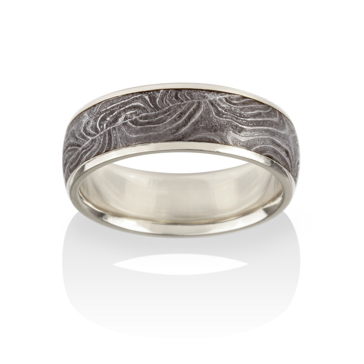 Silver with a textured, patterned center on a white background.