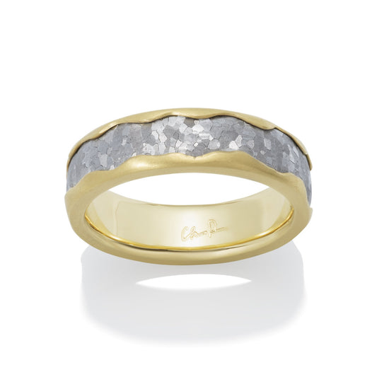 Two-tone gold wedding band with a textured silver center on a white background.