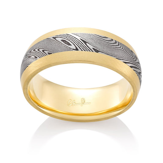 Yellow gold ring with a Damascus steel pattern on a white background.