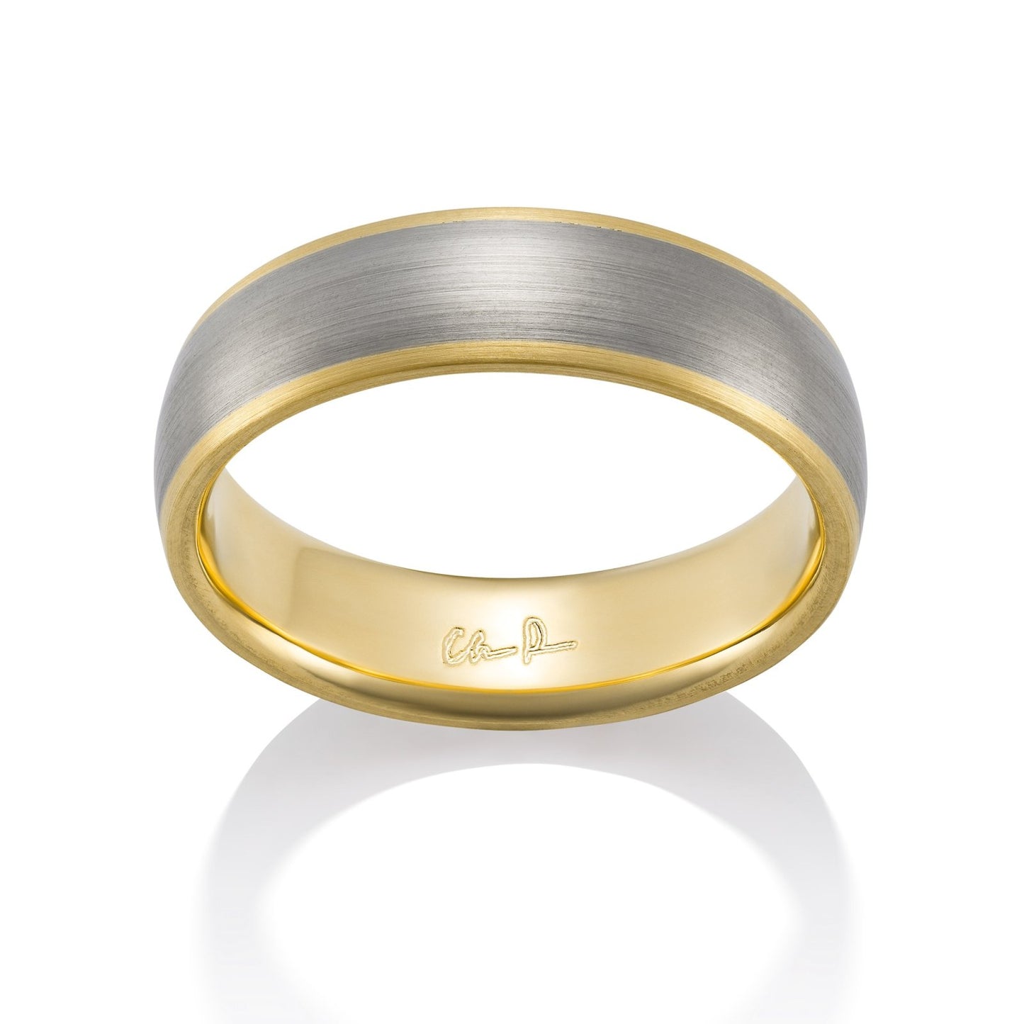 Yellow gold ring with a brushed finish on a white background