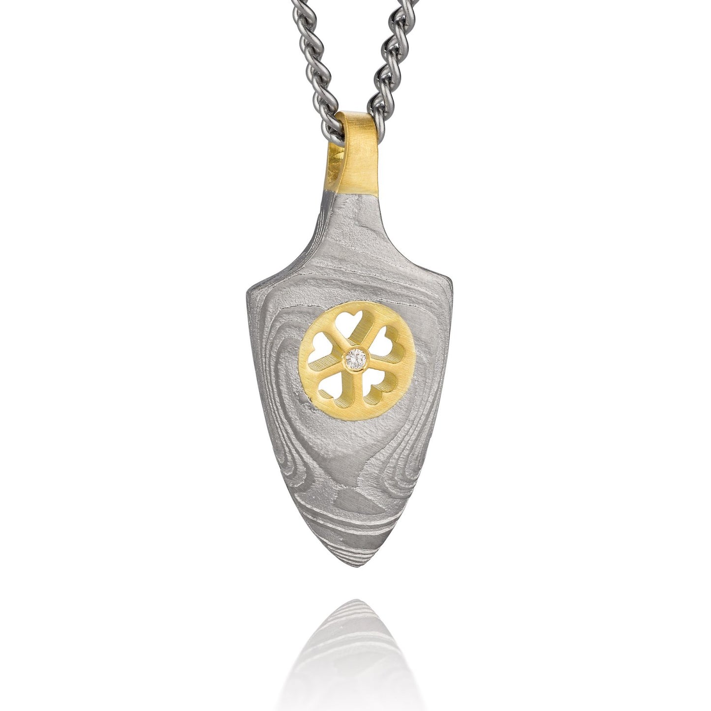 Gold shield-shaped Damascus necklace on a white background. 