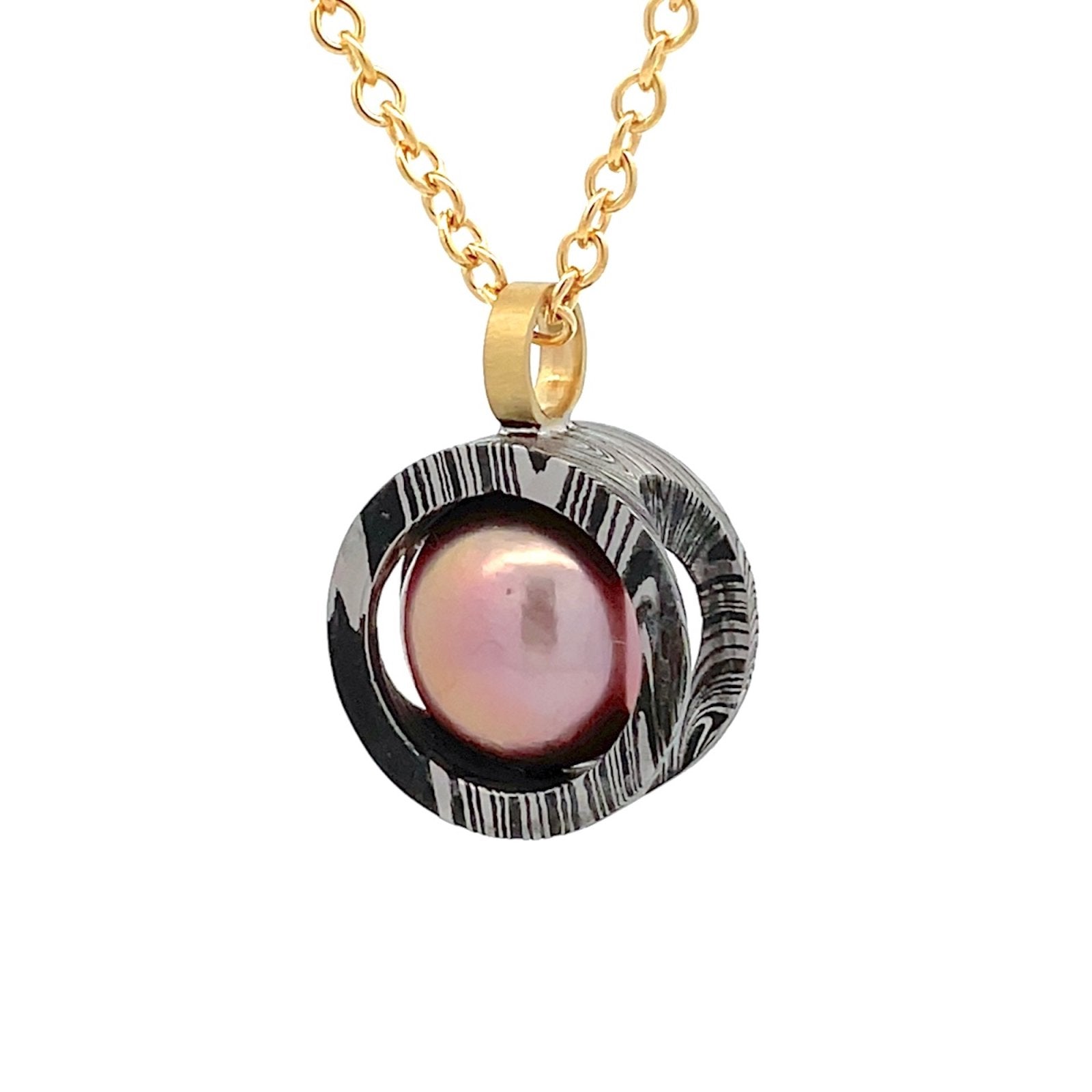 Gold chain necklace with a pink pearl pendant  on a white background.